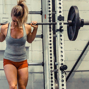 Squats build strength, grow glutes, and are a fundamental part of personal training programs for women especially. 